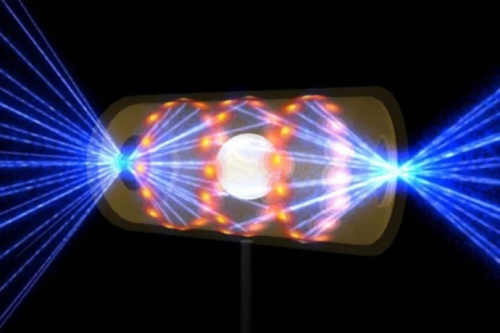 Artist's rendering showing a NIF target pellet inside a hohlraum capsule with laser beams entering through openings on either end.Photo: NIF