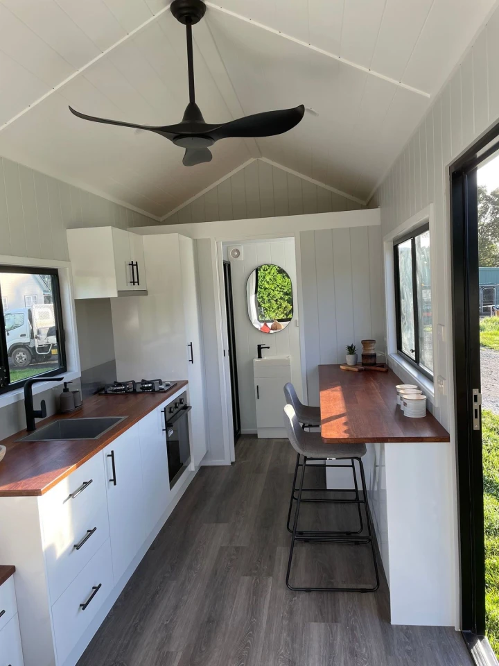 The Sierra Tiny Home features a simple and open interior layout