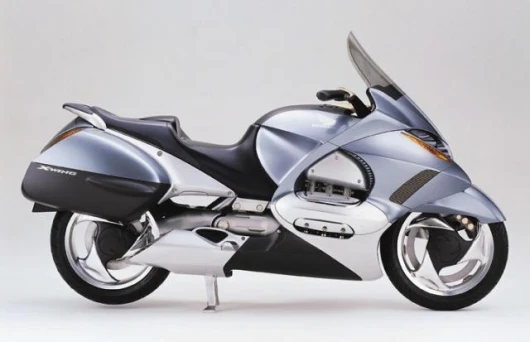 Honda's X-wing prototype was shown at the 1999 Tokyo Motor Show. The X-Wing featured an electronically adjustable fairing, ventilation, screen height, seat height and backrest.