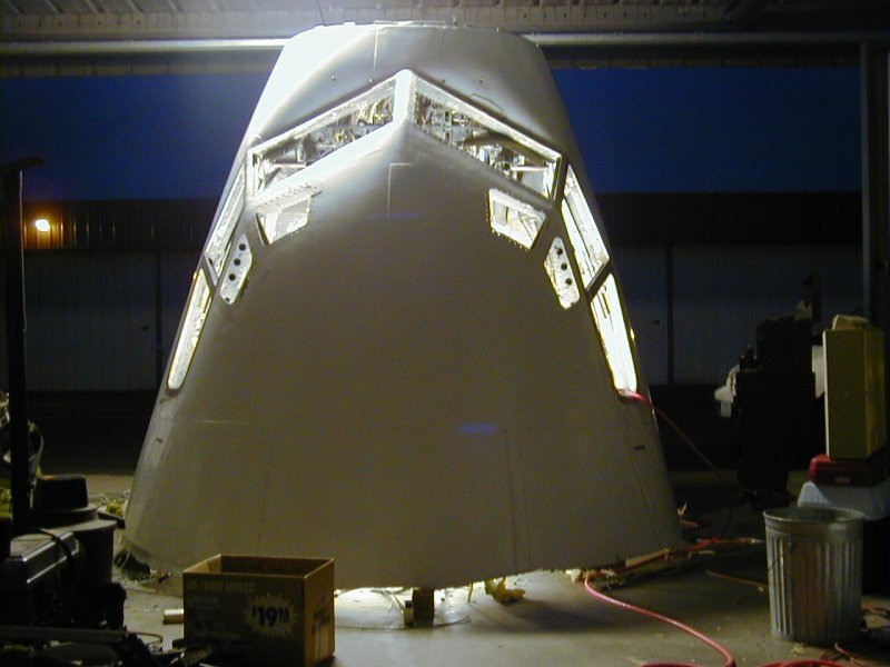 The 737 nose section is moved into its new hangar home