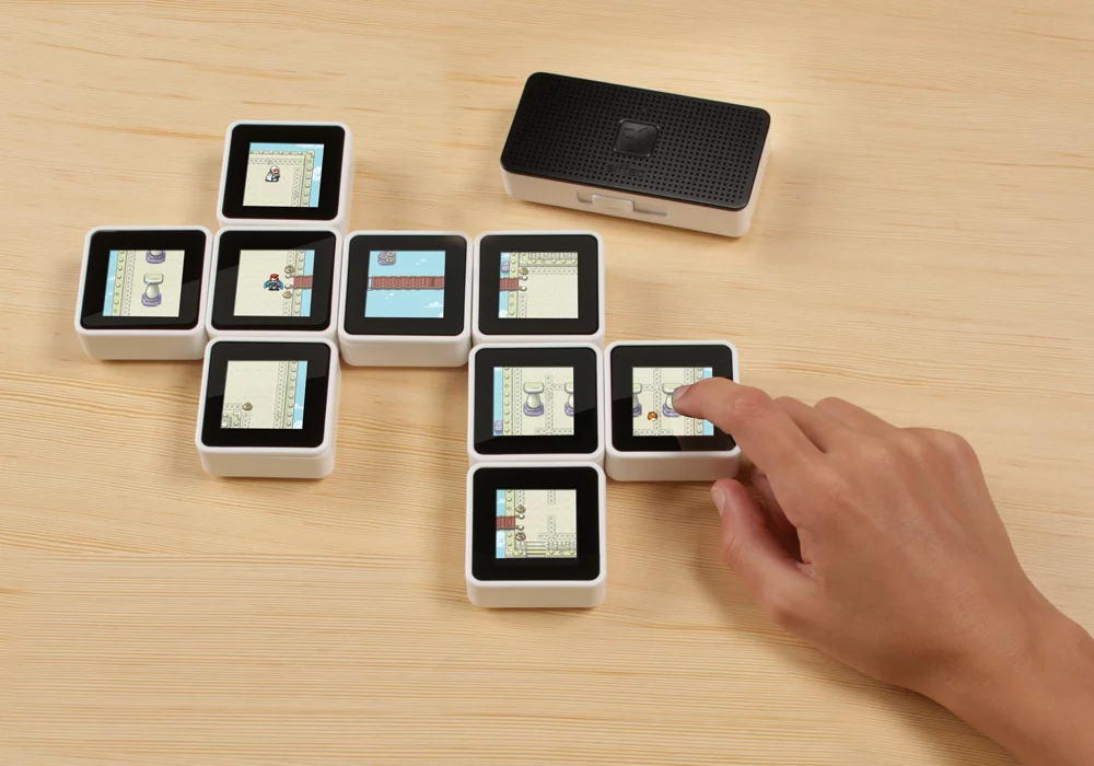 The Sifteo Cubes Intelligent Play system has been updated so that up to 12 blocks can be used at any one time (instead of 6 previously) and now includes a new Sifteo Base that adds portability to gameplay