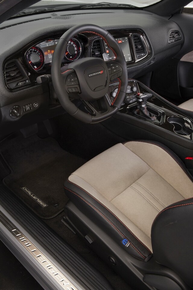 Inside, the Dodge Challenger GT AWD continues with the Header Orange color in its stitching on the Katzkin leather