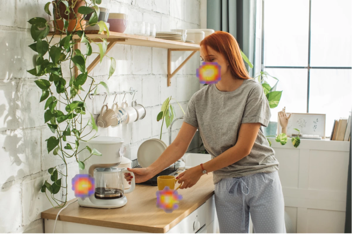 Where are the noises coming from in this picture? According to the SoundCam Go, from the coffeemaker, the mug, and her mouth