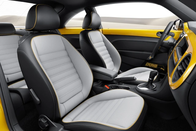 The interior features black leather and Gobi sport fabric upholstery, aluminum dash accents, and a high-resolution 7.7-inch AMOLED touchscreen