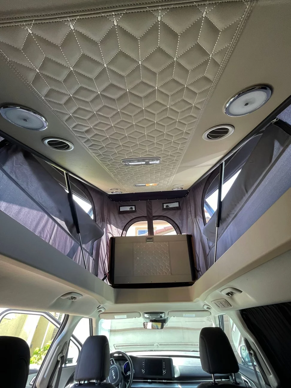 While the Univan RT CL doesn't have an indoor kitchen or bathroom, the bed still lifts out of the way to open up headroom inside the van