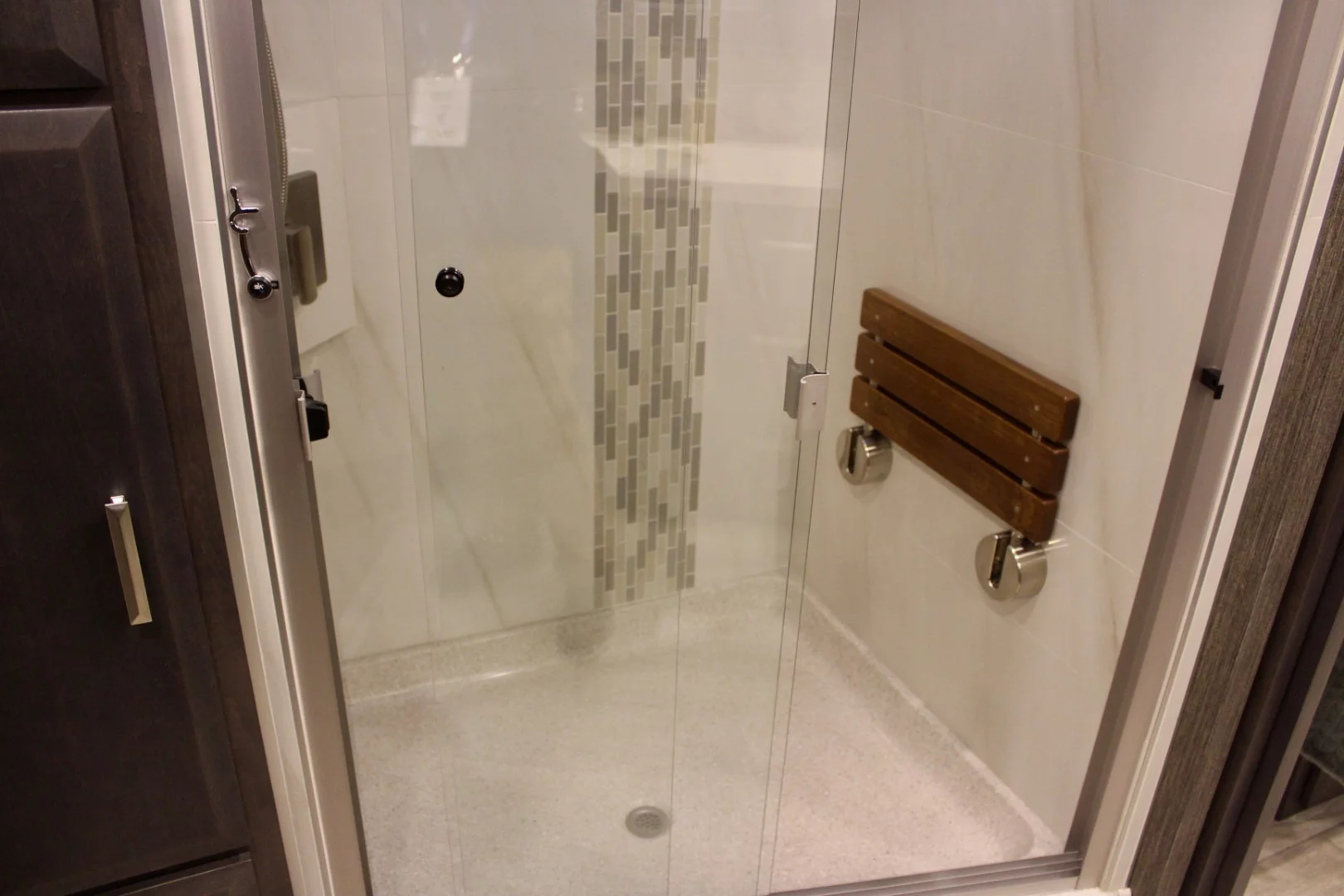 The shower even includes a foldaway seat