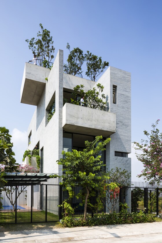 Vietnam's Vo Trong Nghia Architects designed the Binh House, in Ho Chi Minh City, which keeps three generations of the same family naturally cool using passive design