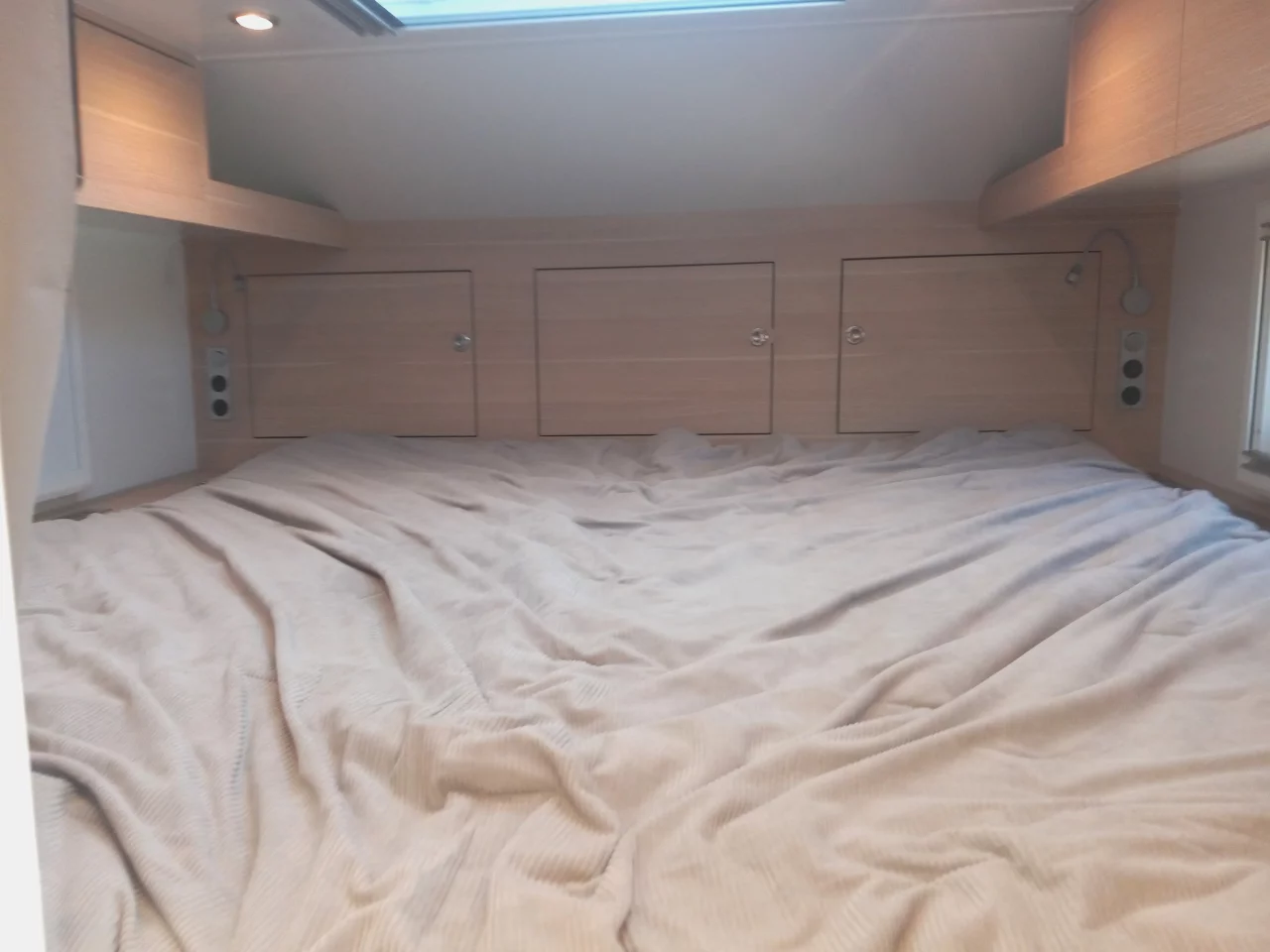 The alcove fits a proper king-size bed and still has room to surround it with HVAC vents