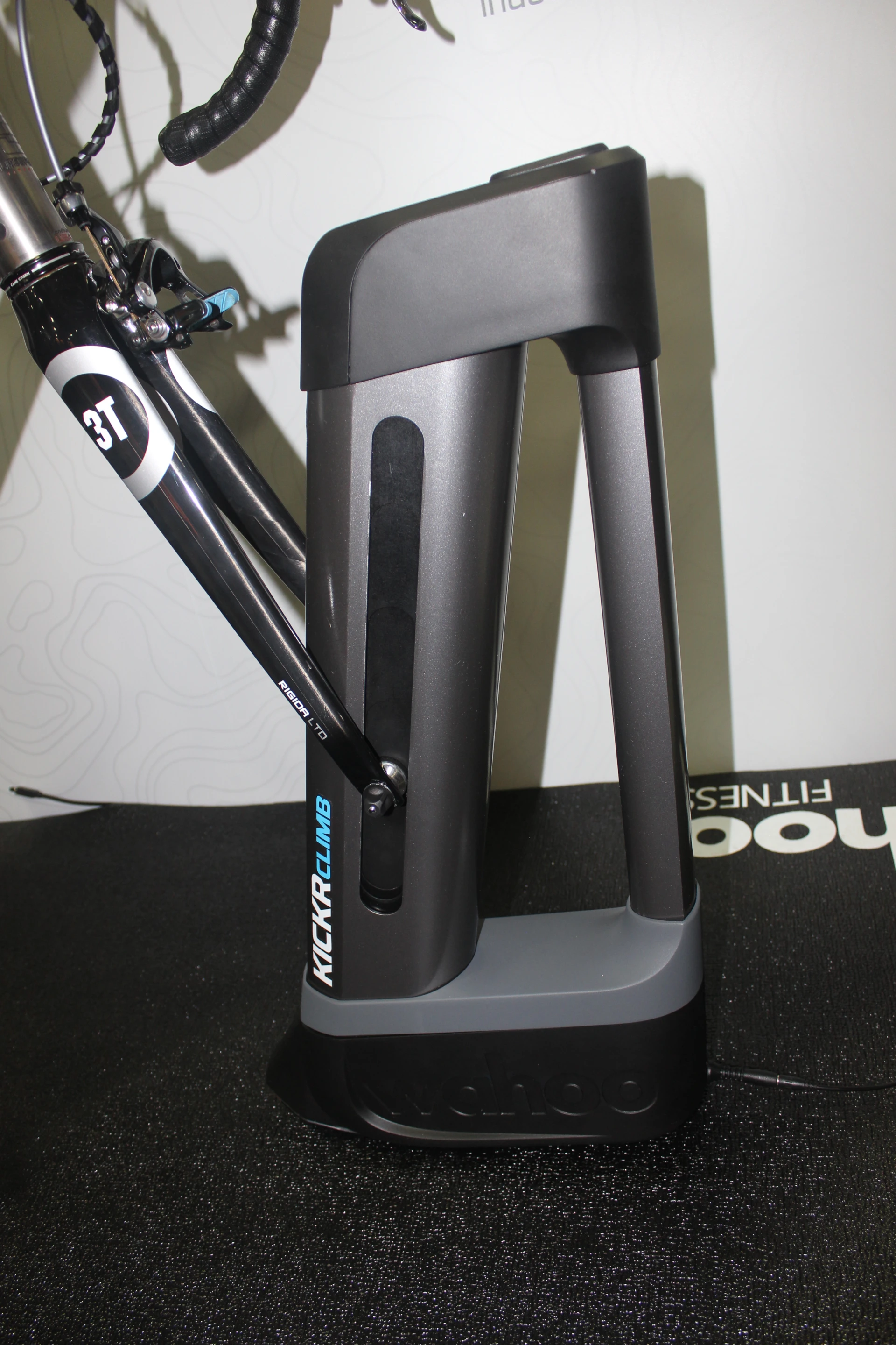Wahoo Fitness' Kickr Climb raises and lowers the front of the bike when it's mounted on one of the company's indoor trainers, simulating climbs and descents