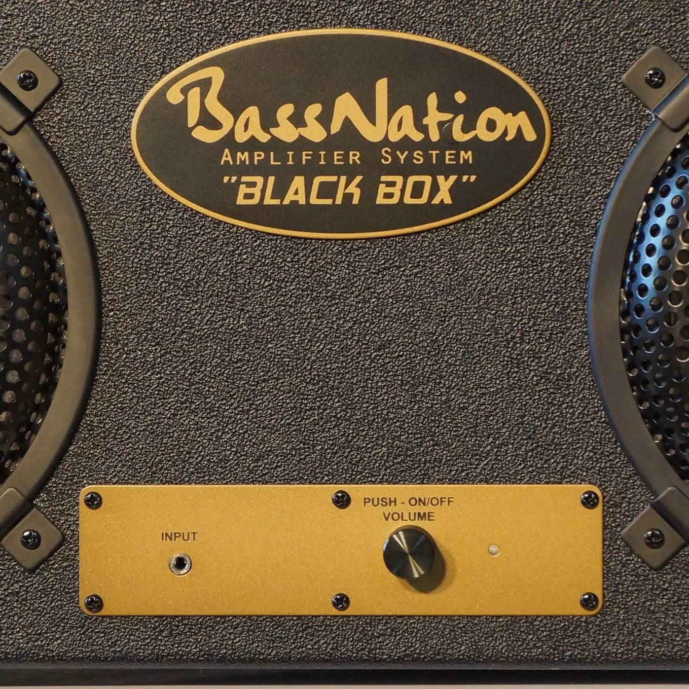 Close up of the front steel plate with power on/off volume control and 3.5-mm input jack