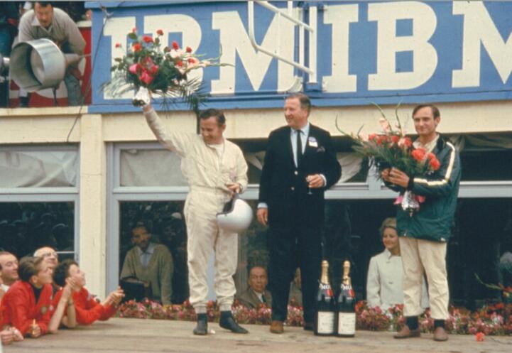 The winners of the 1966 Le Mans 24 Hour race, New Zealanders Bruce McLaren and Chris Amon, flanking Henry Ford II. McLaren went on to found the McLaren marque after giving Ford its finest moment in racing.