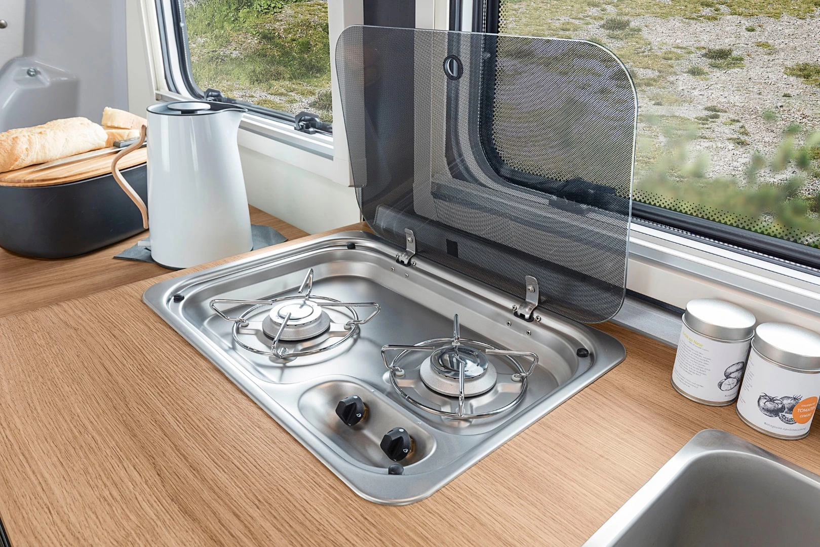 The Travelino kitchen has a dual-burner stove, sink and refrigerator