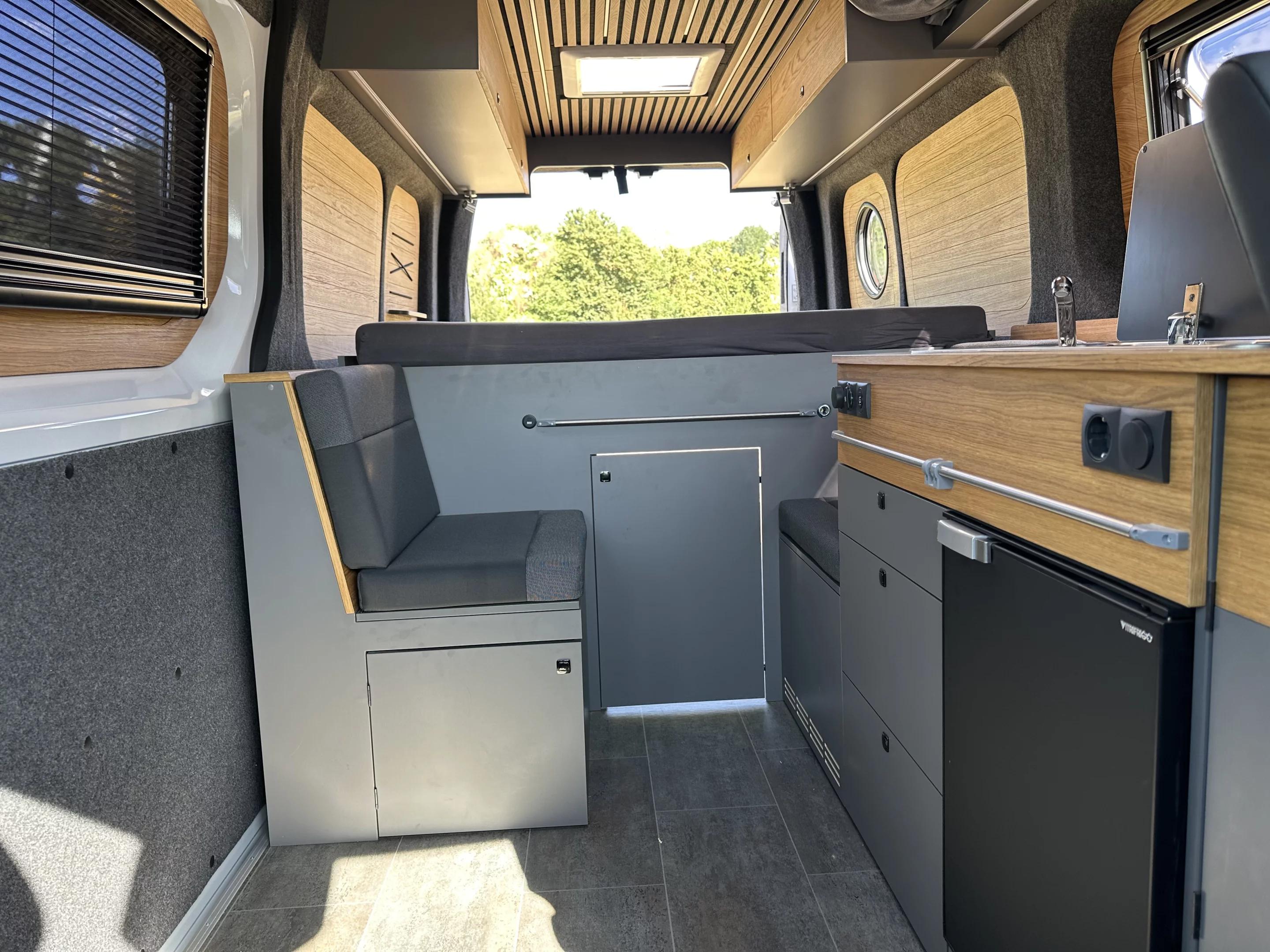 The Eiffeland Interstar-e camper includes a driver's side kitchen with dual-burner stove, sink and compressor fridge