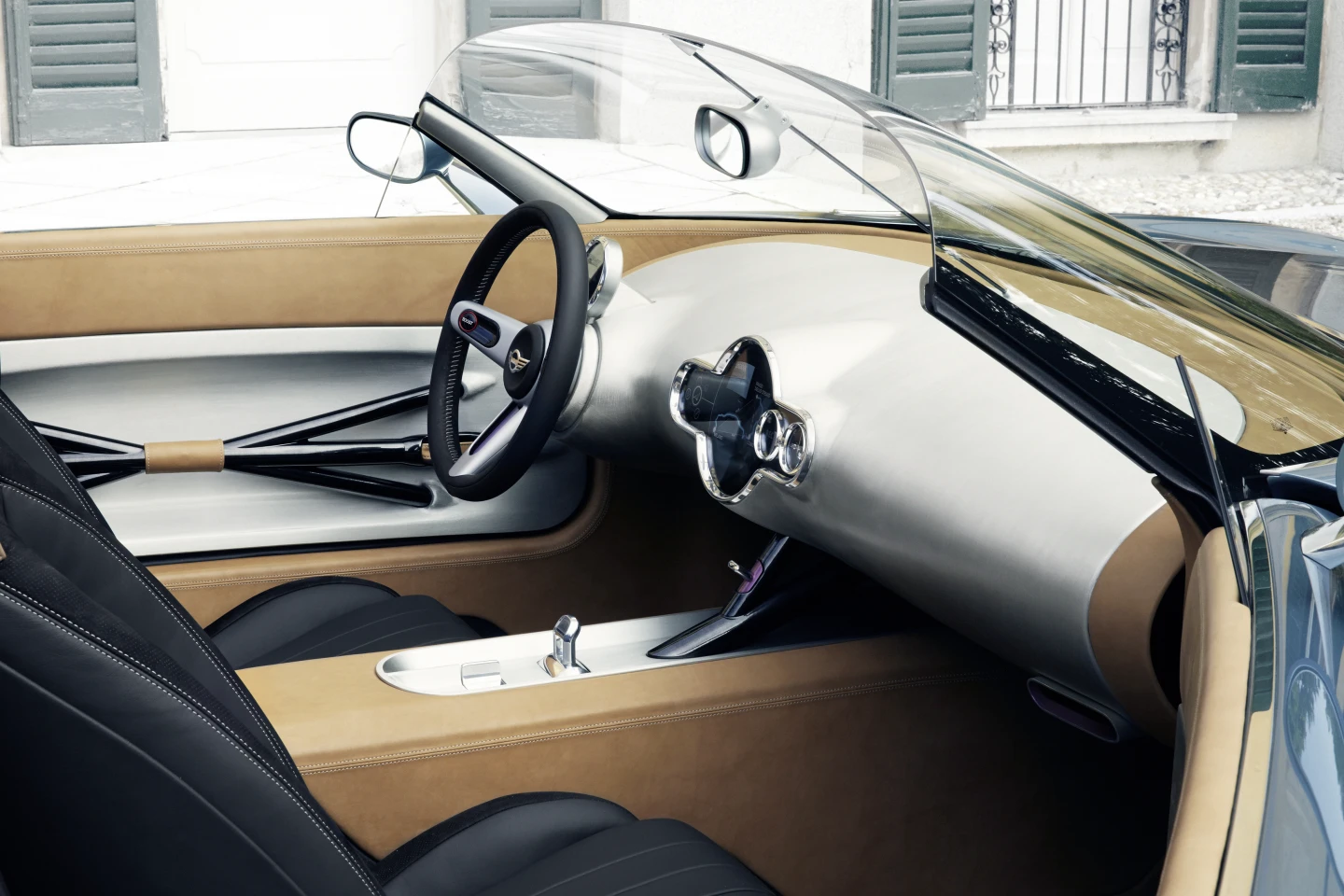 The bare center console is again an exercise in minimalism, playing off the unfinished look of the matte aluminum dashboard