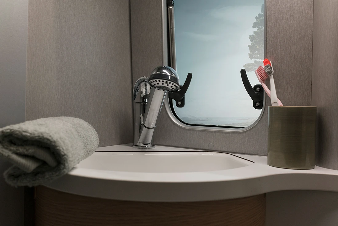 The bathroom faucet doubles as an indoor/outdoor shower