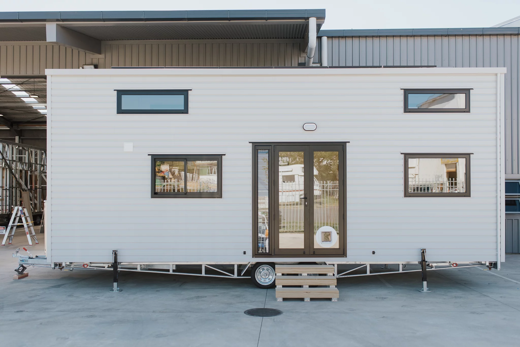 The Dreamweaver Tiny House has a vinyl exterior