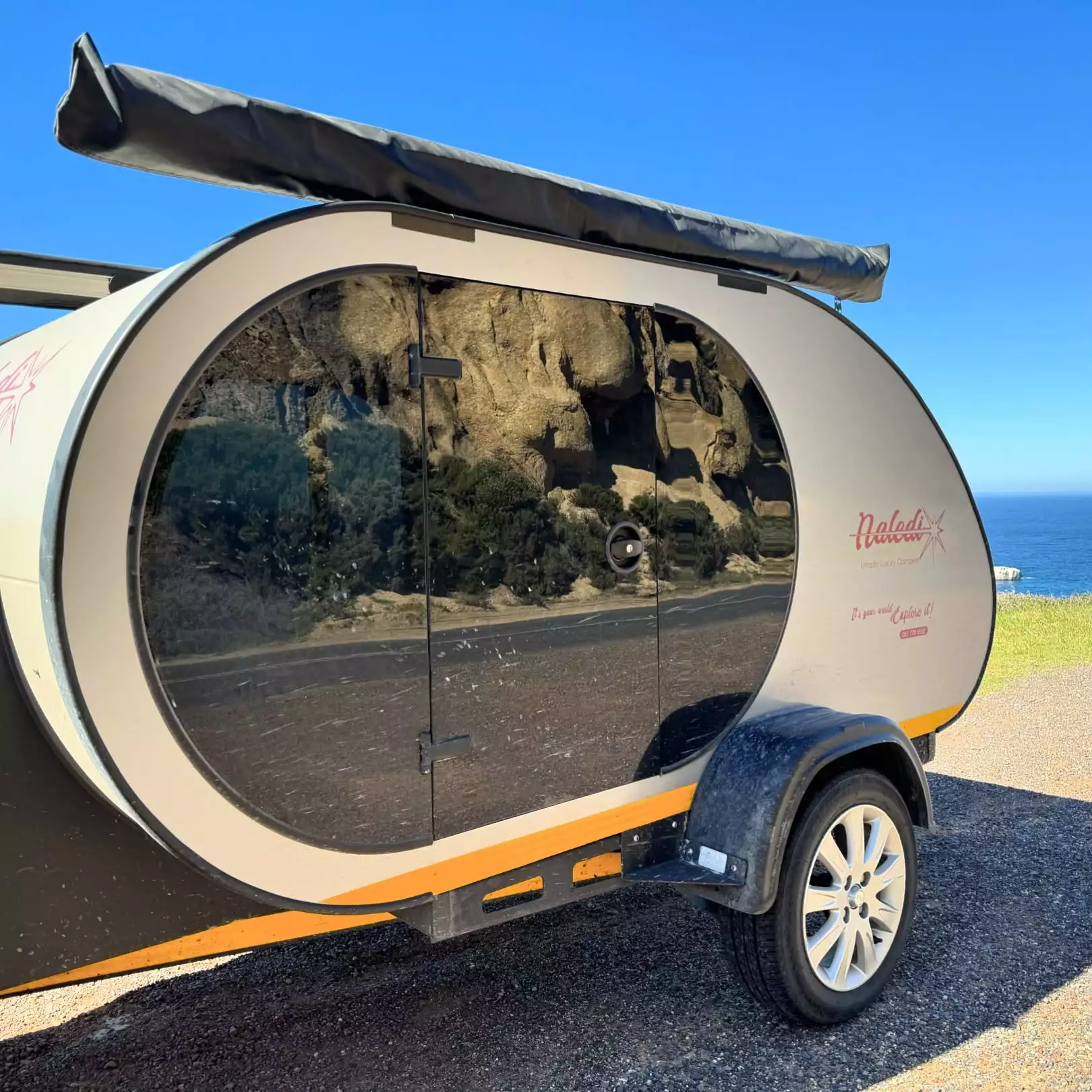 The darkened safety glass is designed to hold up to life on (and off) the road