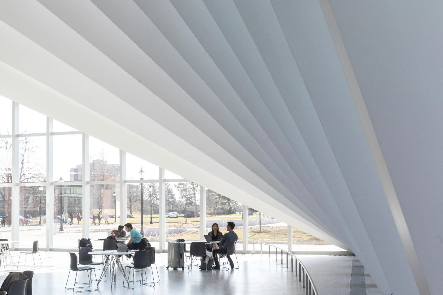 Visitors enter the Business Innovation Hub into a multi-story atrium, which includes dining and seating facilities