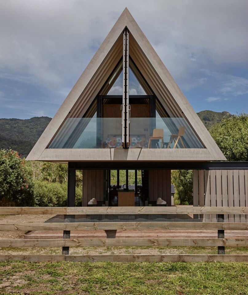 The home features the use of natural timber and a dramatic pitched roof
