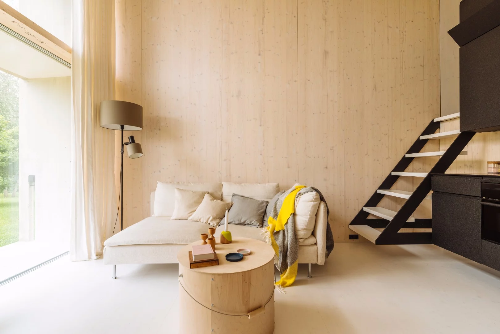 The living room looks surprisingly airy and is filled with natural light