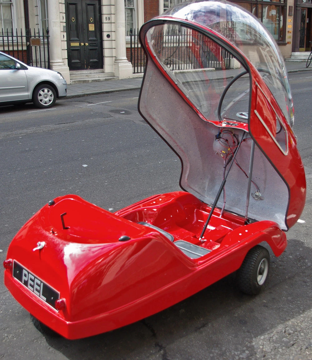 The three-wheeled Peel Trident microcar with its distinctive bubble dome open