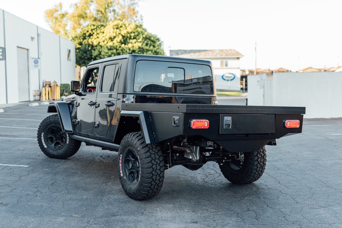Pop the canopy and roof-top tent off, and you have a flat-bed Jeep pickup