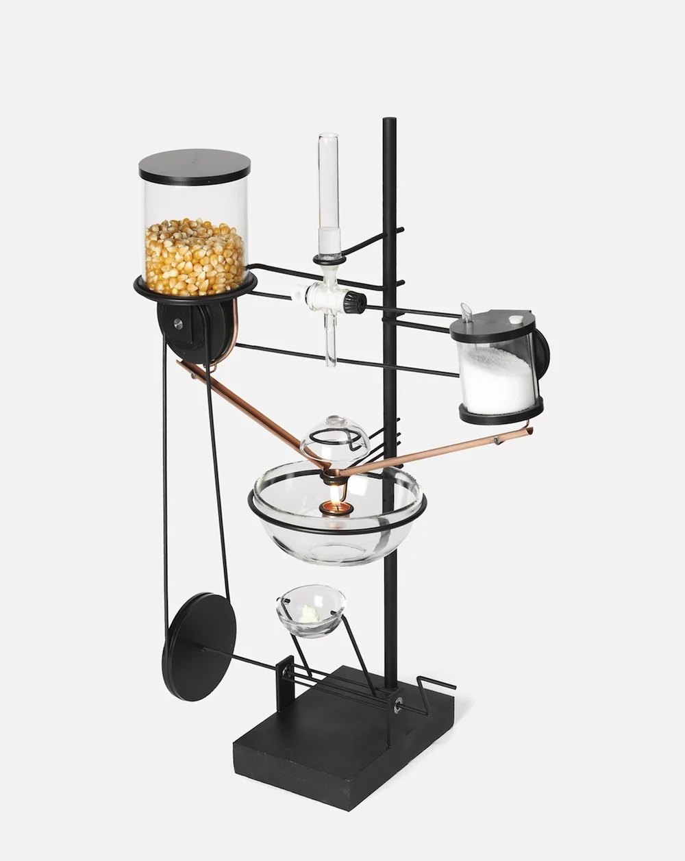 Oncle Sam utilizes a tea-light candle to heat a grain of corn and once duly popped, salt is also added for flavor (Photo: ECAL/Nicolas Genta)