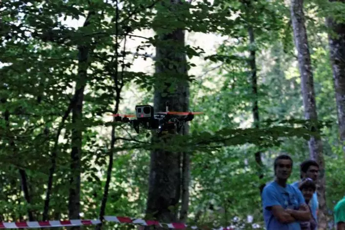Competing in groups of four, the pilots viewed all the action through pairs of goggles, which were fed a stream from micro-cameras built into the front of the drones