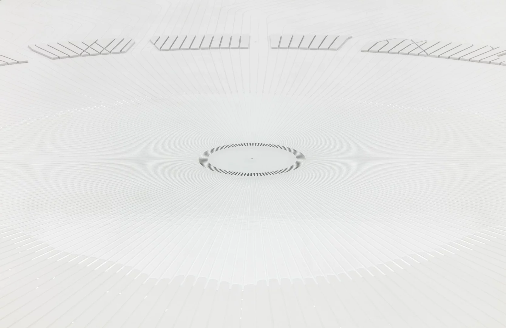 The water installation inside uses water droplets to create a visage resembling the sight of a giant city from space