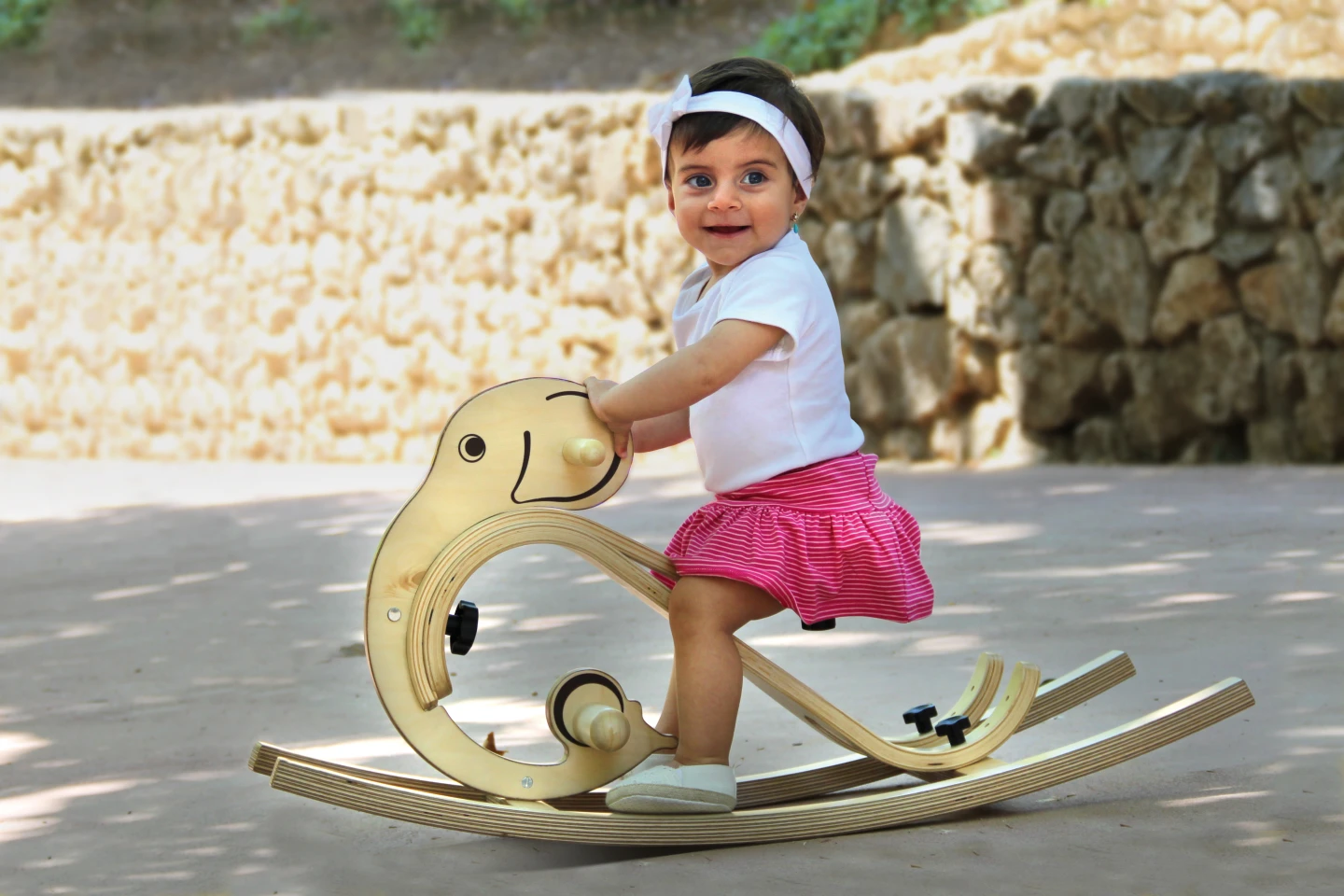 A child enjoys the rocking elephant