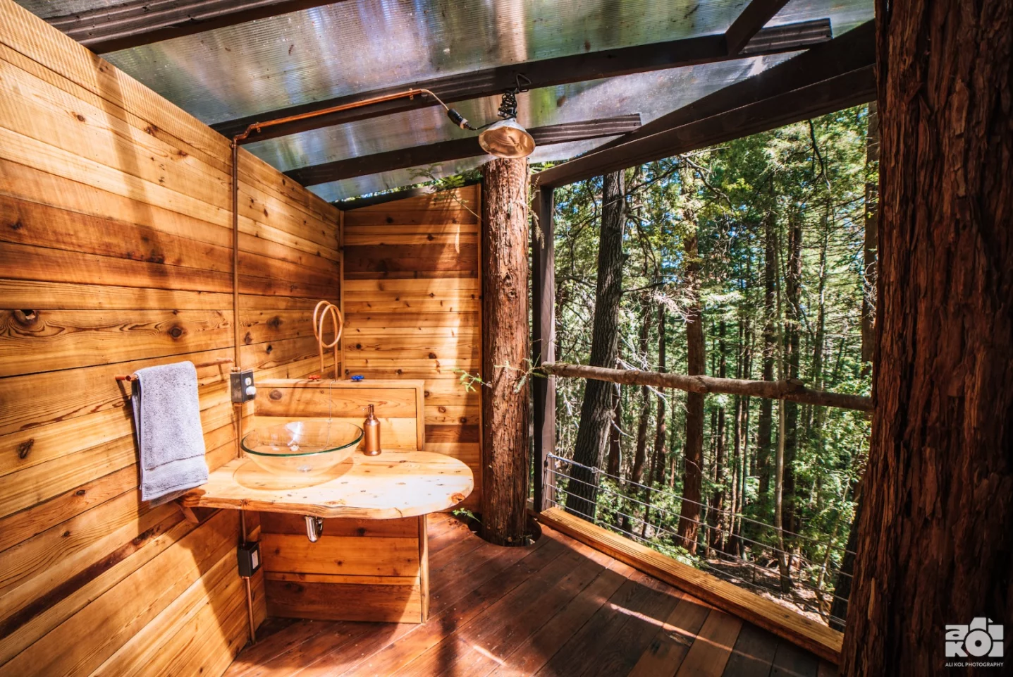 The Pinecone Treehouse's bathroom includes sink, shower, and composting toilet