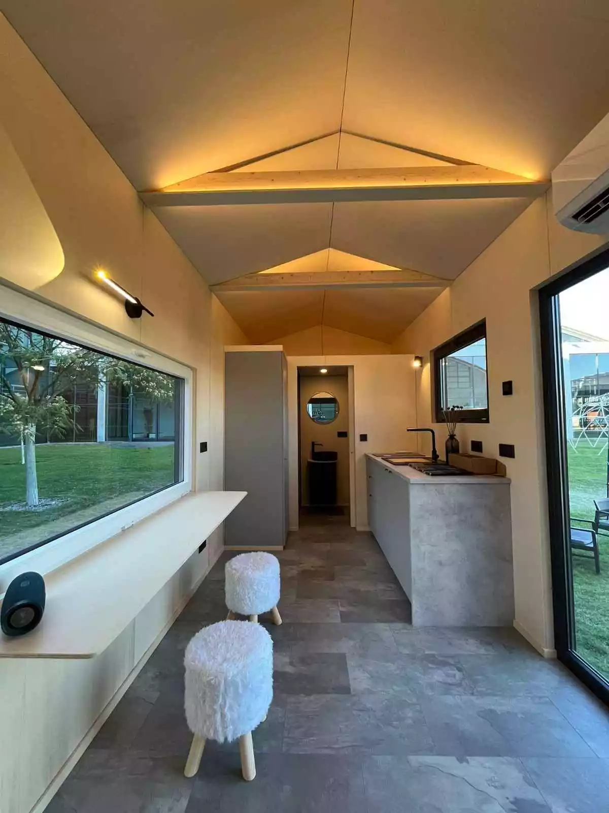 The BTH Single's kitchen area includes a large drop-down dining table/work space