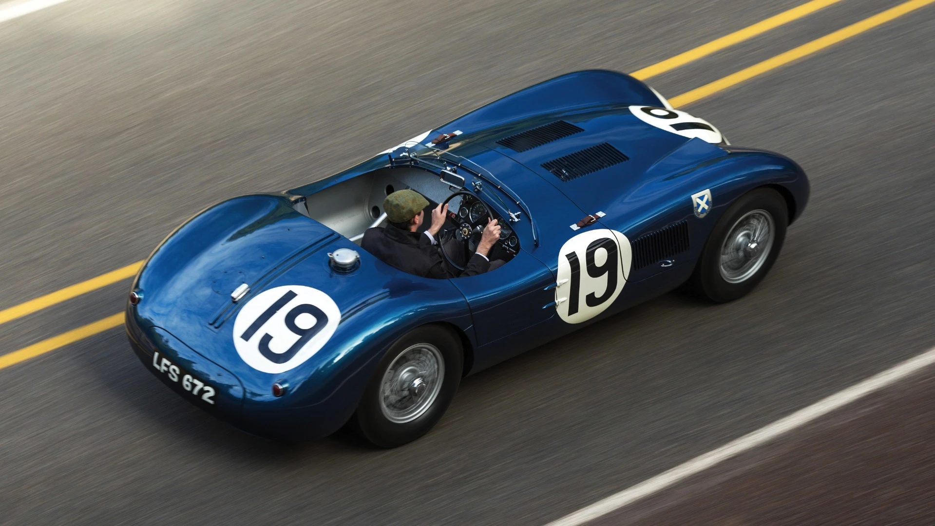 There were just 53 C-Type Jaguars built. Three lightweight works cars (of which this car is one), and a run of 50 cars to satisfy customer demand after the factory cars finished first, second and fourth in the 1953 Le Mans 24 Hour event. The biggest difference to the competition were the disc brakes. Endurance racing was born to demonstrate reliability and validate new automotive technologies for the masses and just as it has done more recently with hybrid and diesel drivetrains, Le Mans heralded the coming of age of a new braking technology with this car and its works siblings. The winning C-type was the first to average more than 100 mph for the 24 Hours of Le Mans (105.8 mph, 170 km/h), and this car, which finished fourth, also broke the ton, averaging 104 mph (167 km/h). Equally at home in any of the world’s finest concours or vintage rallies, this car represents a landmark in Jaguar history.