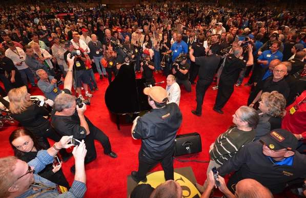 Jerry Lee Lewis singing "Great Balls of Fire" at the auction of his 1959 Harley-Davidson. Photo by John Hollansworth Jr., Courtesy of Mecum Auctions