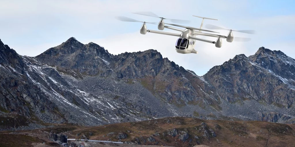 Small wings on the top and tail improve the eTransporter's range at speed