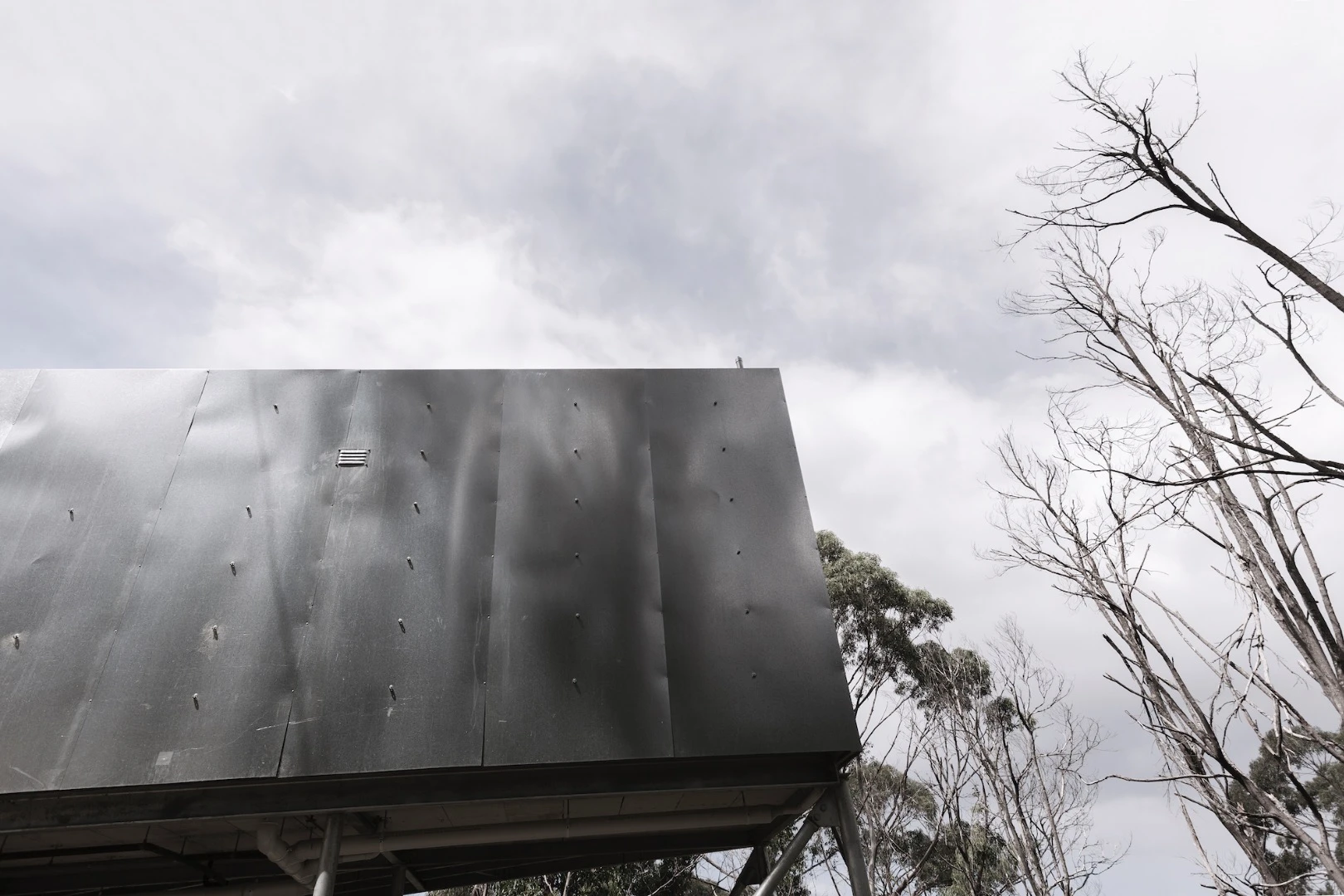 House 28's shipping containers are covered in external insulation, which is in turn covered in galvanized steel