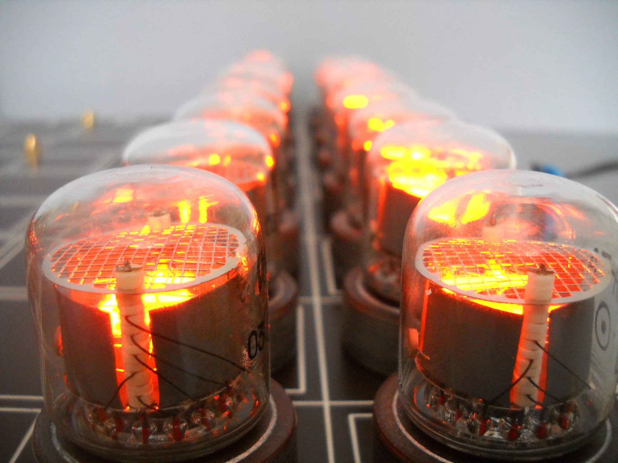 They may look to be burning hot but unlike vacuum tubes, the gas-filled Nixie tubes are cool enough to handle