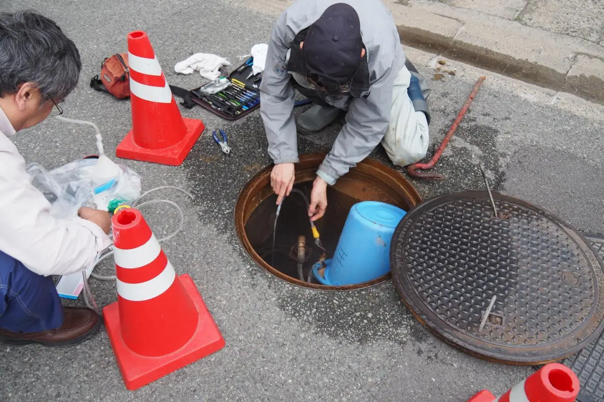 Scientist collect groundwater from a well near the site of this year's Kumamoto earthquake