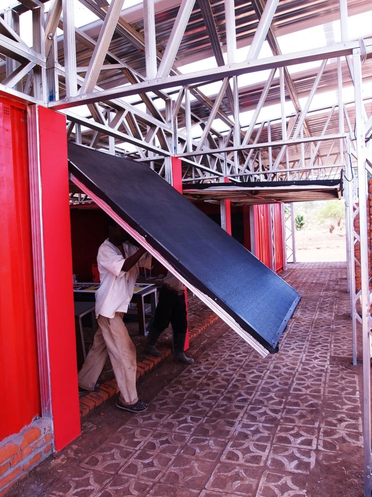 Shutters can be opened to turn the classrooms into a semi-outdoor space (Photo: Architecture for a change)