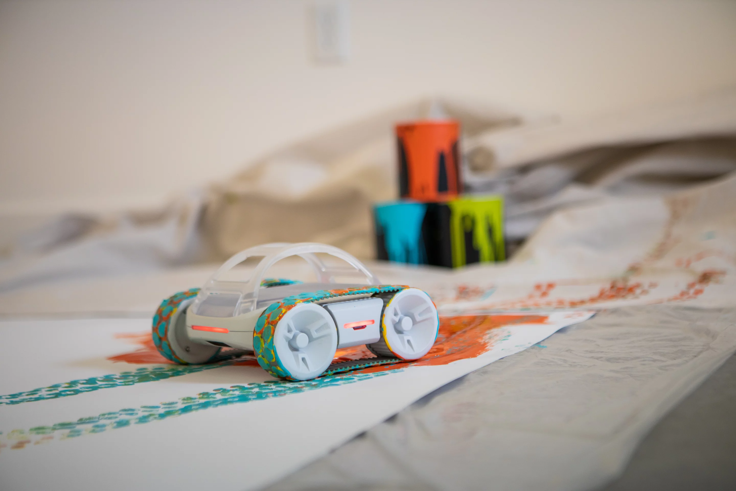 The Sphero Rvr can be used as an app-controlled artist, painting the canvas with its rubber tracks