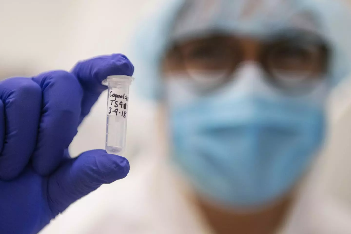 University of Montana researcher Meradeth Snow holds a vial containing ancient human DNA