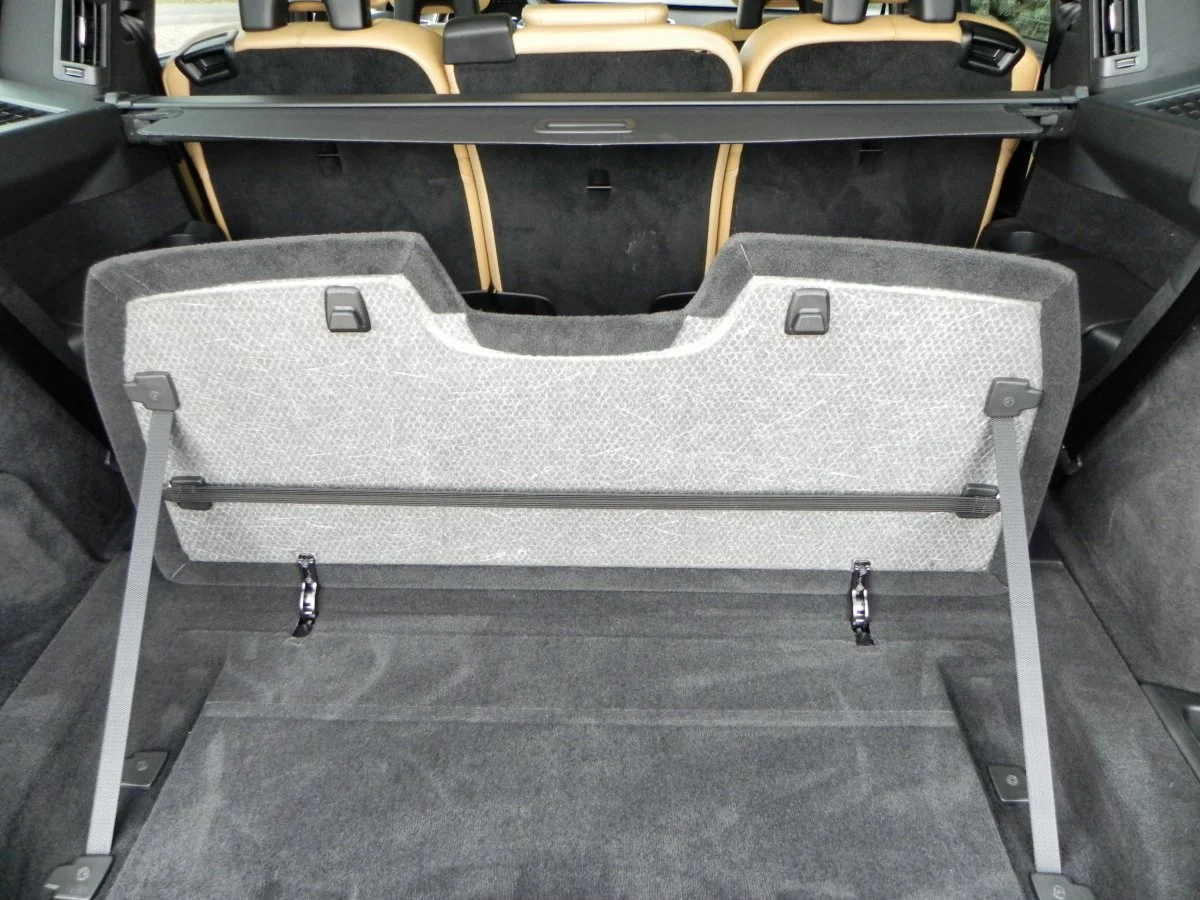 Built-in cargo organization gadgets like this integrated divider pop-up help keep things where they're intended to be on the drive home
