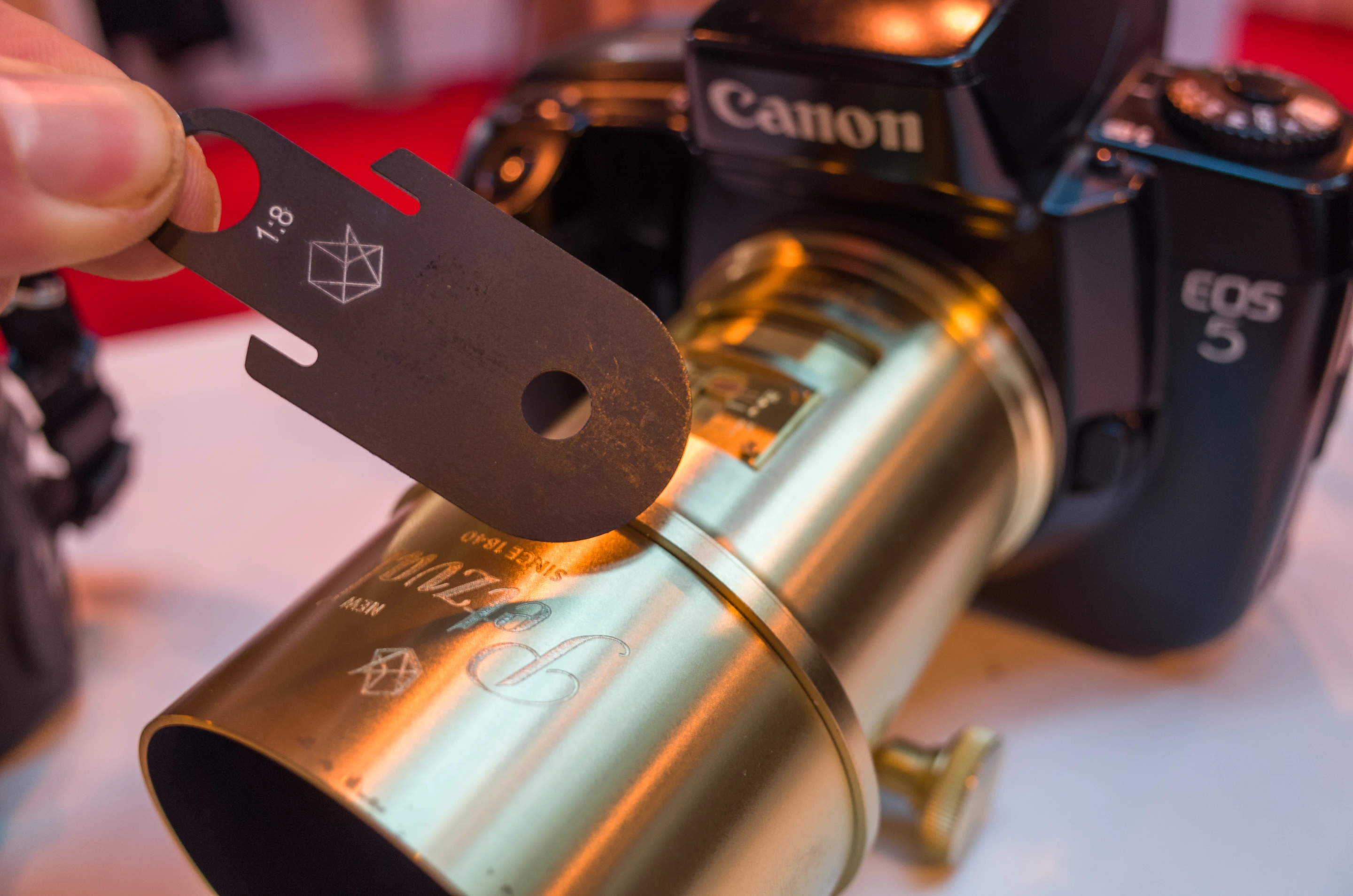 Aperture of the Lomography New Petzval lens is controlled by inserting aperture plates - which each have different sized holes - into the lens barrel
