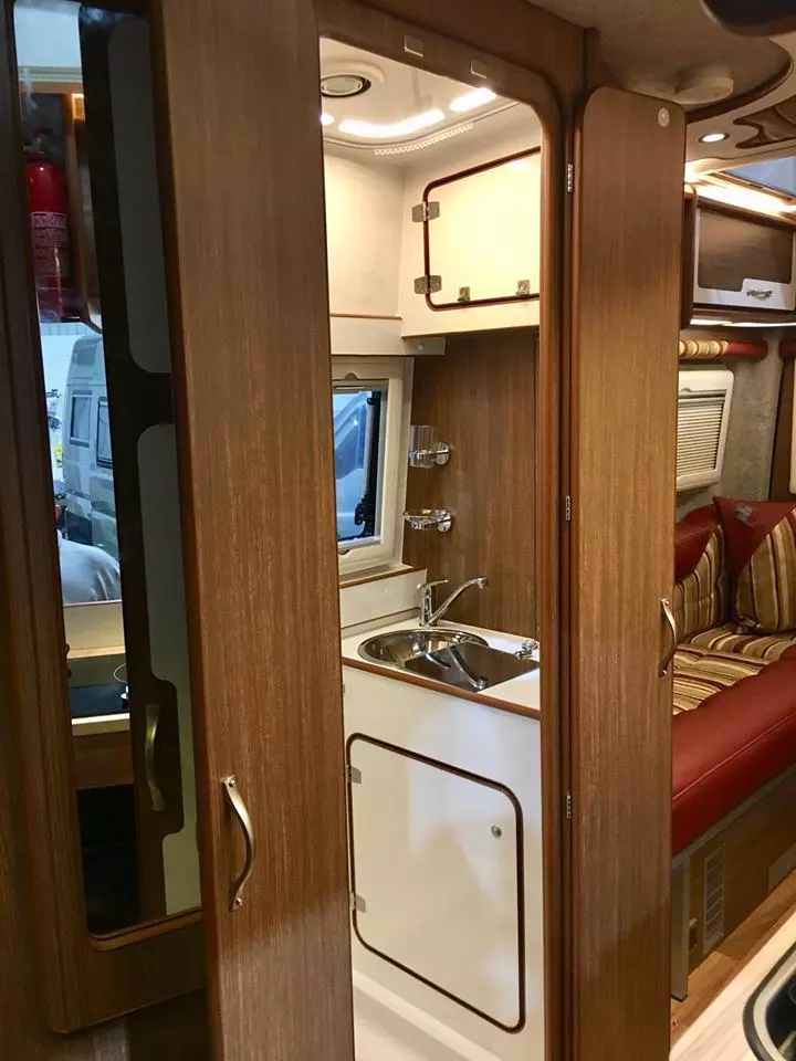 The bathroom includes a dual-door design