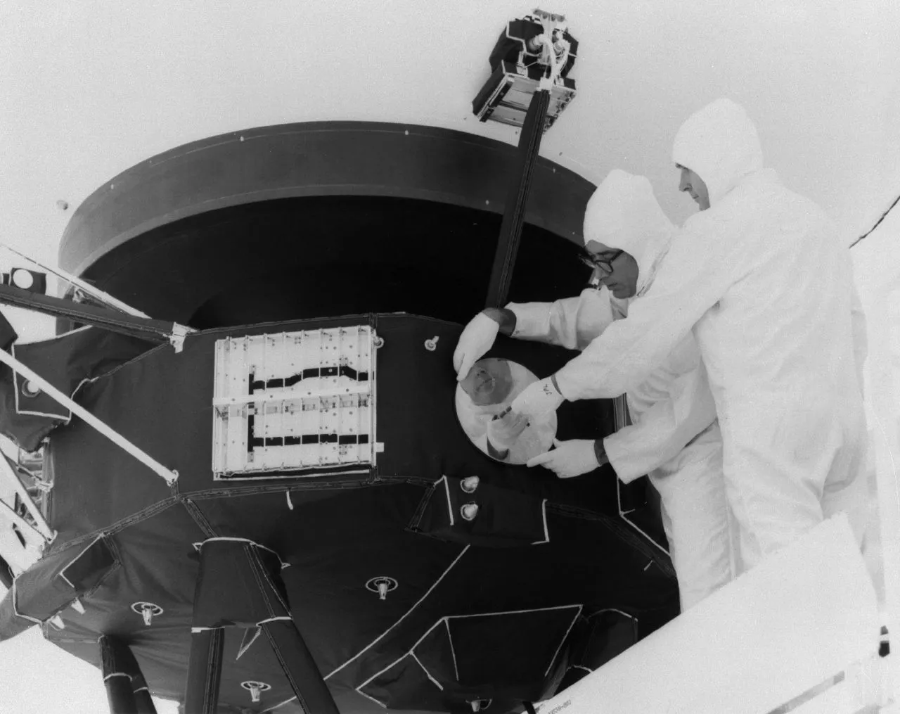 The Voyager record being bolted to the spacecraft