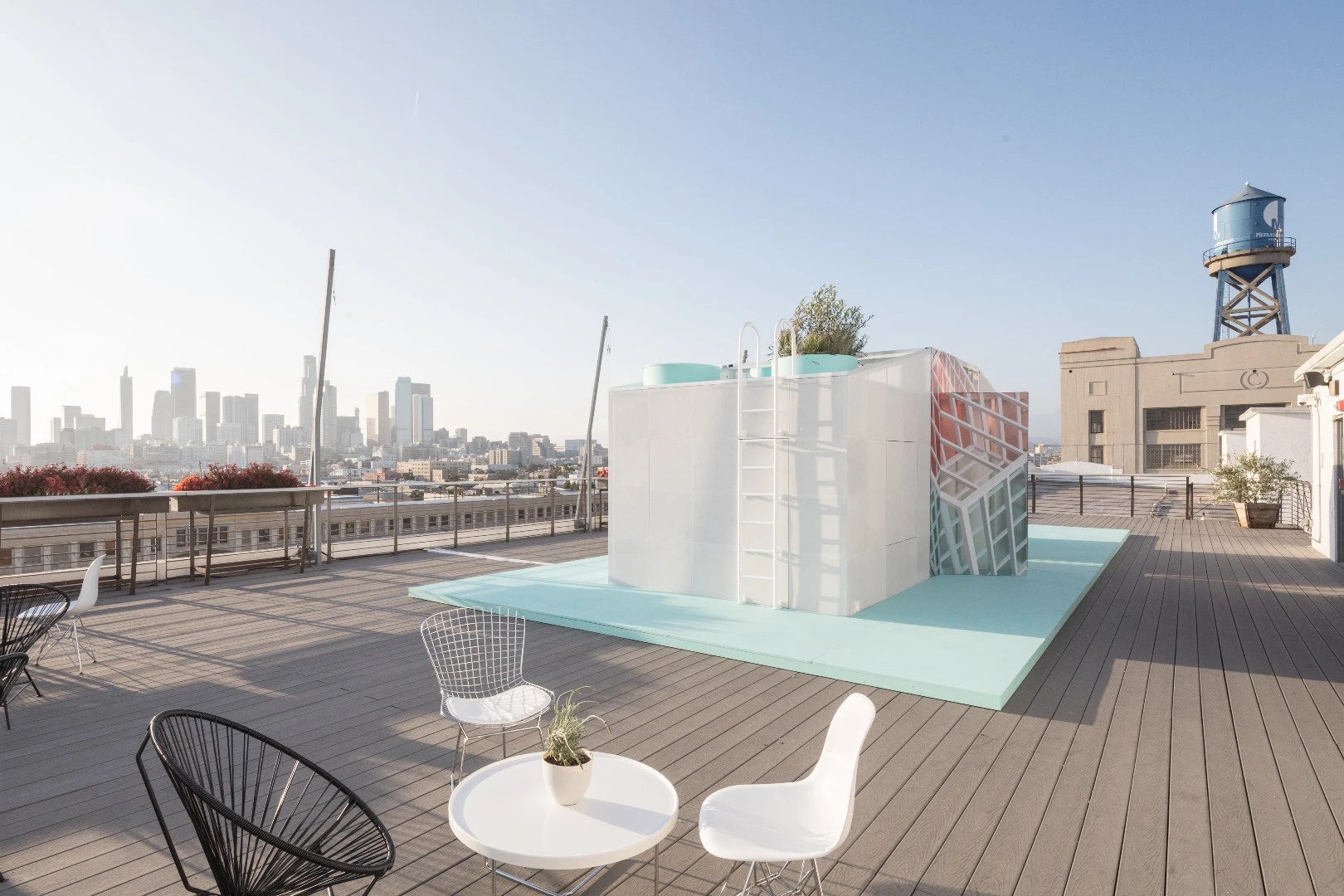 Space-saving mechanisms like folding dining tables and shelves and rotating panels feature throughout the Mini Living Urban Cabin in LA