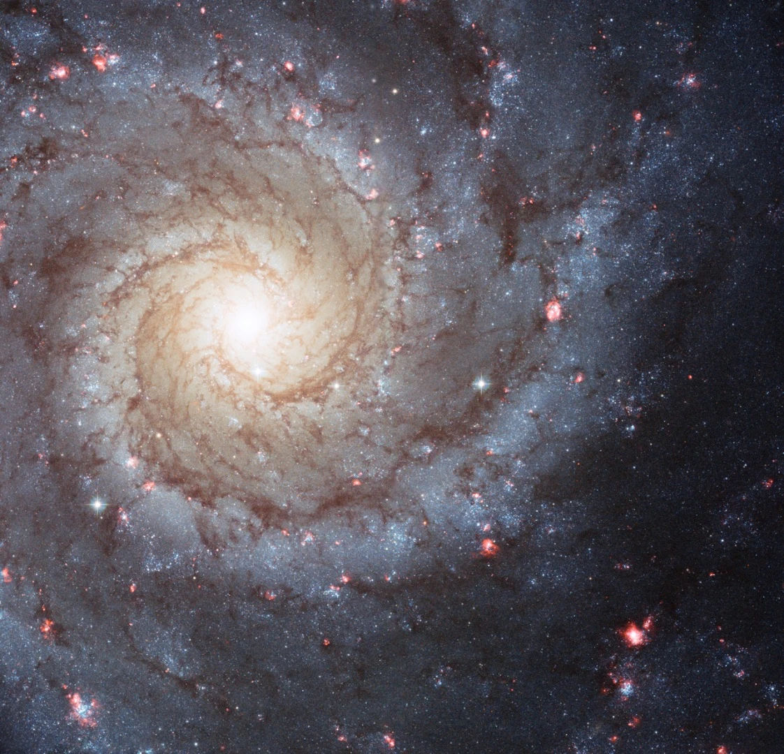 Messier 74 is located roughly 32 million light-years from Earth in the direction of the constellation Pisces