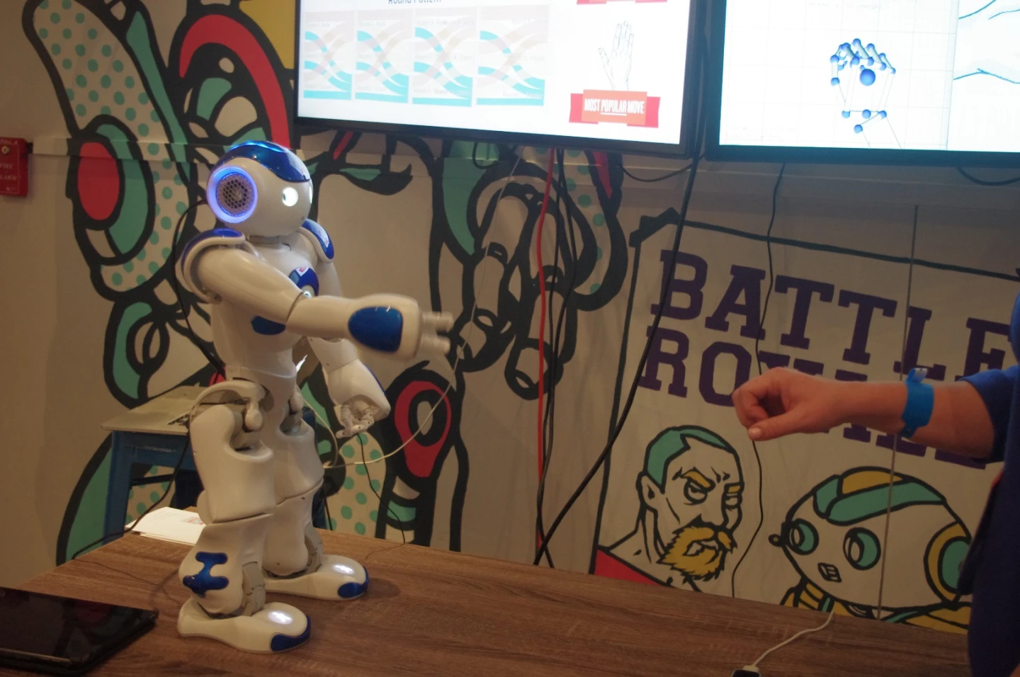 A smaller version of Pepper, the emotion-sensing robot, was at IBM's Cognitive Studio installation where he challenged visitors to a game of rock, paper, scissors