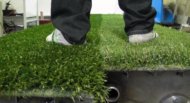 Panels of artificial turf combine to make a full field