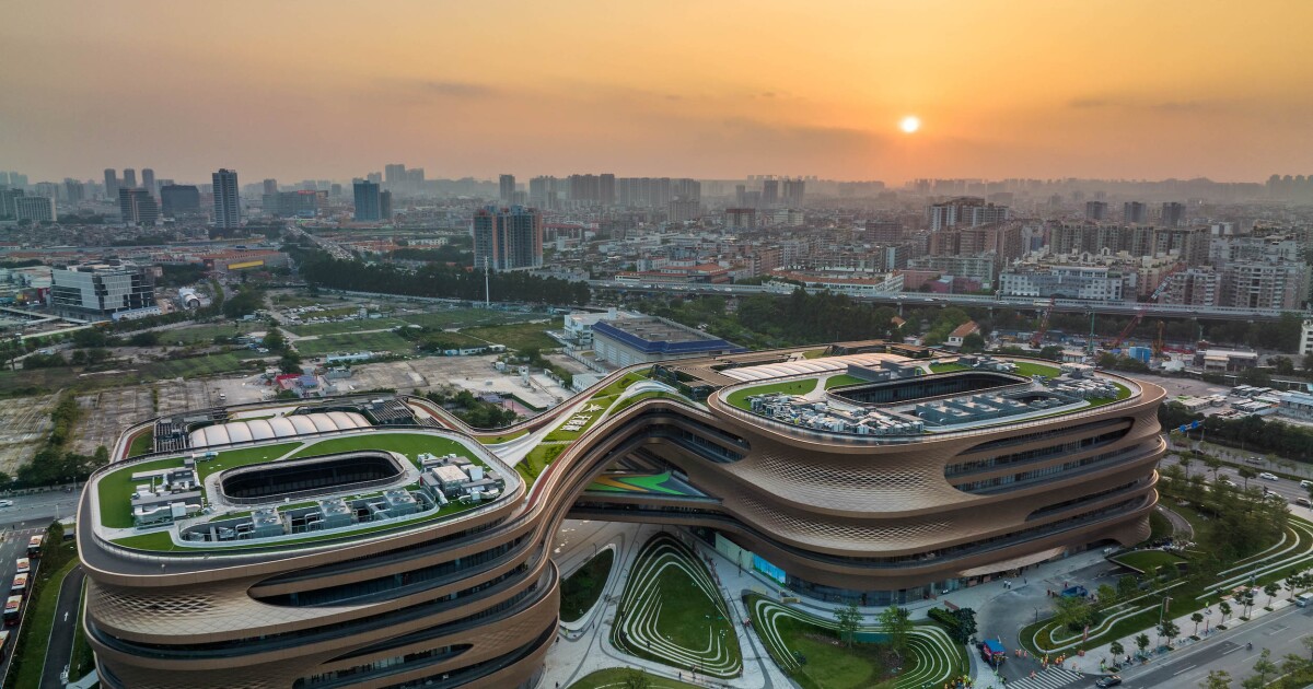 ZHA-designed divided office straddles subway to form symbol for infinity